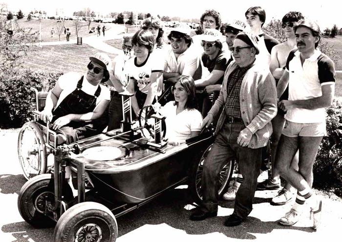 Students in the bath tub derby "race car" they designed