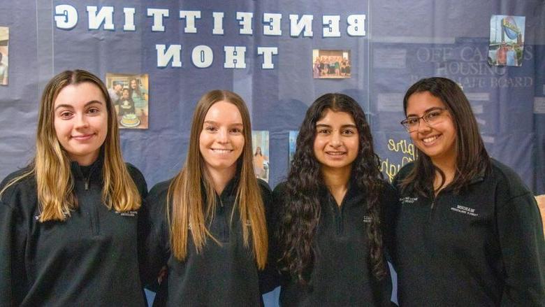 Four female Berks students smile for the camera